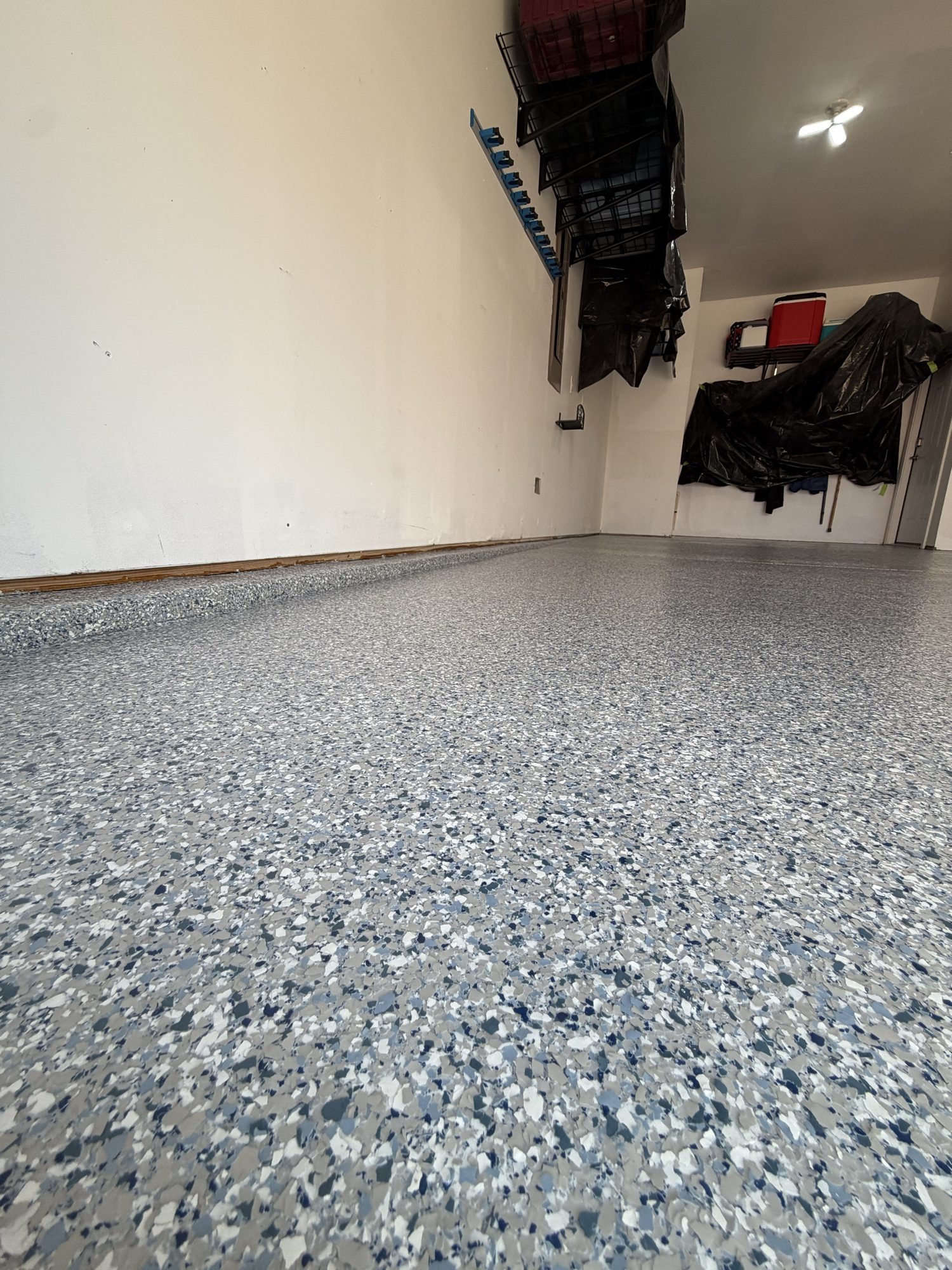 Blue and gray flake epoxy garage floor by Southern Surfaces LLC