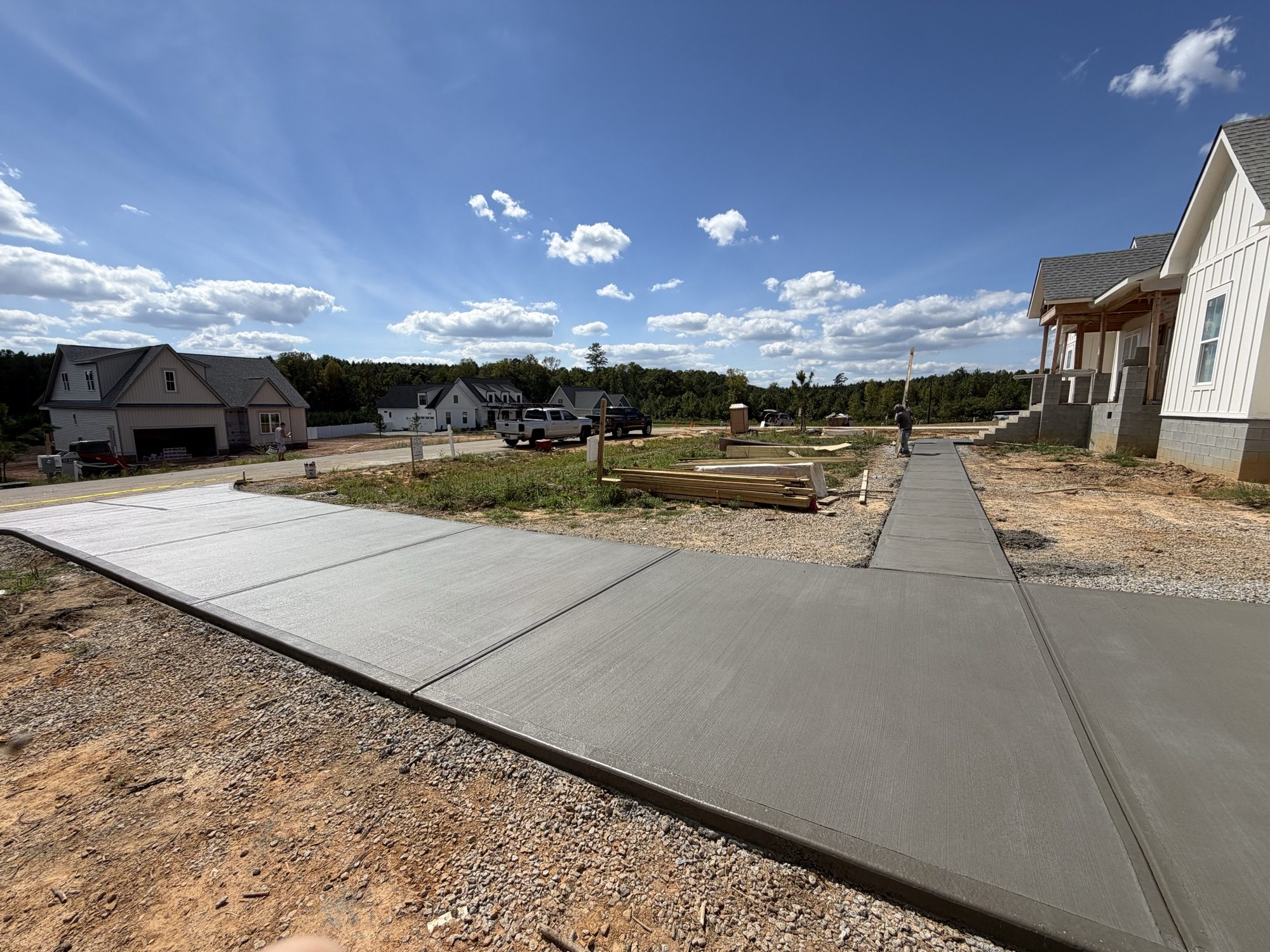 New concrete driveway and walkway poured by Southern Surfaces LLC