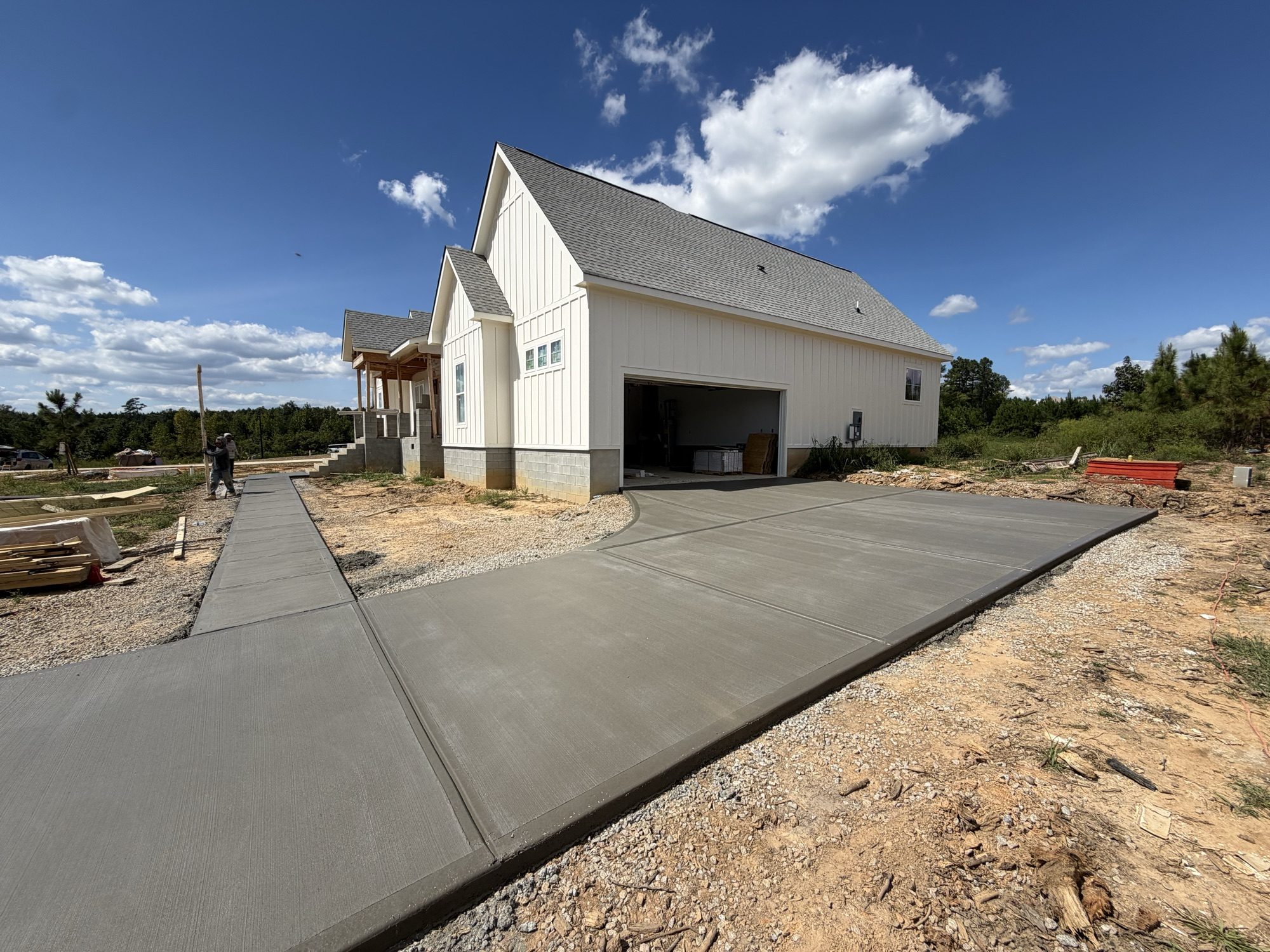 New concrete driveway installation by Southern Surfaces LLC